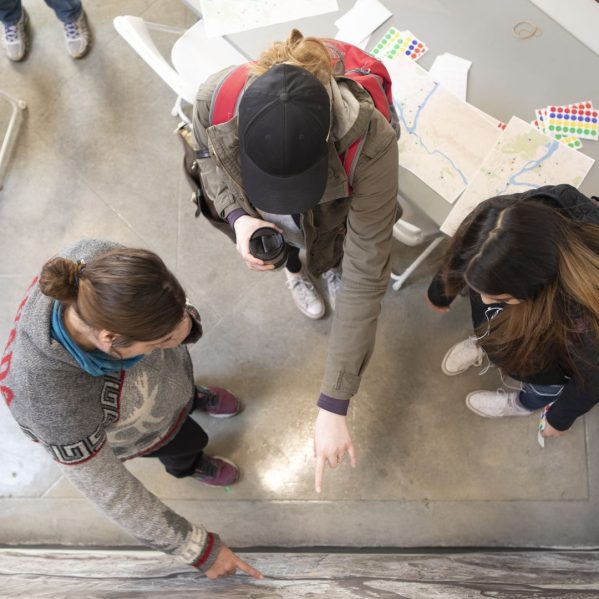 Three students collaborating on a research project.