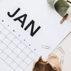 blank calendar flipped to January with paper clips in the bottom corner.