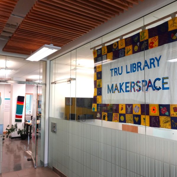 TRU Library Makerspace banner hanging in the entrance to the right of Tim Hortons.