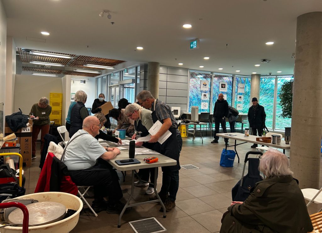 Outside the makerspace as customers register and wait to get items fixed by members of the Kamloops Repair Cafe team.