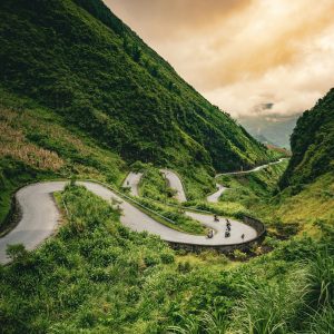 Motorcycles traveling the road on the Ha Giang Loop in Vietnam.